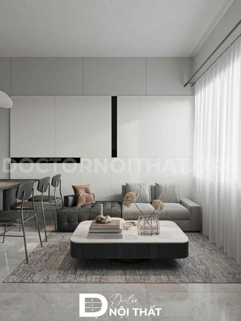 Không gian phòng khách tối giản với sofa xám trung tính, bàn trà mặt đá bo góc