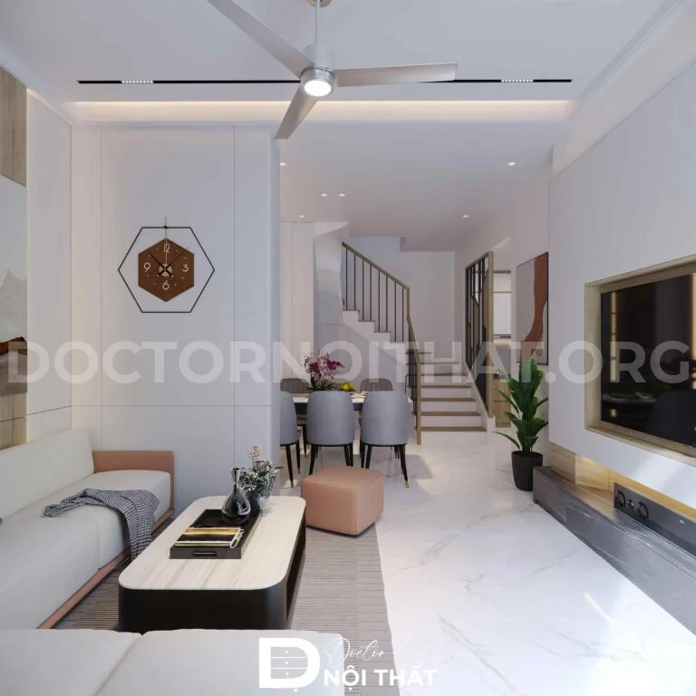 Phòng khách sáng thoáng với sofa chữ L, bàn trà bo góc và vách tivi ốp gỗ tinh tế